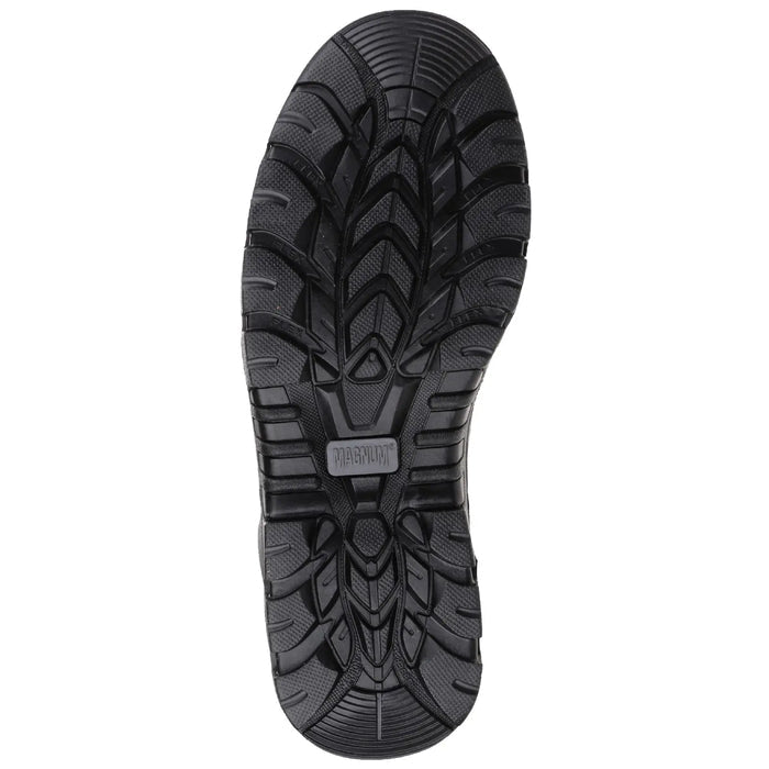 A black shoe sole lies flat showing detailed tread patterns designed for traction and stability in outdoor or rugged environments highlighting its functionality for various activities