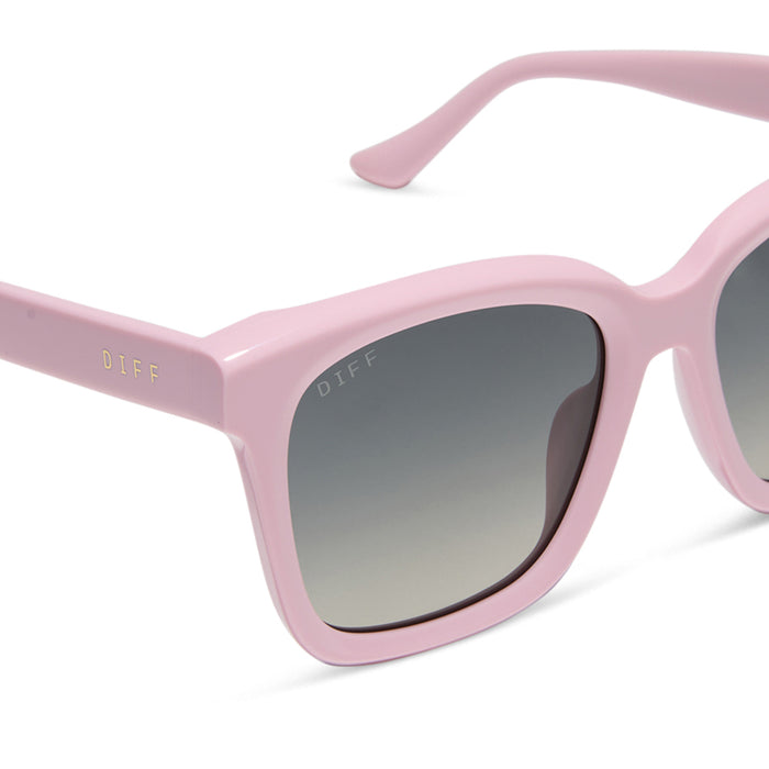 diff eyewear featuring the meredith square sunglasses with a powder pink frame and grey gradient polarized lenses detailed view