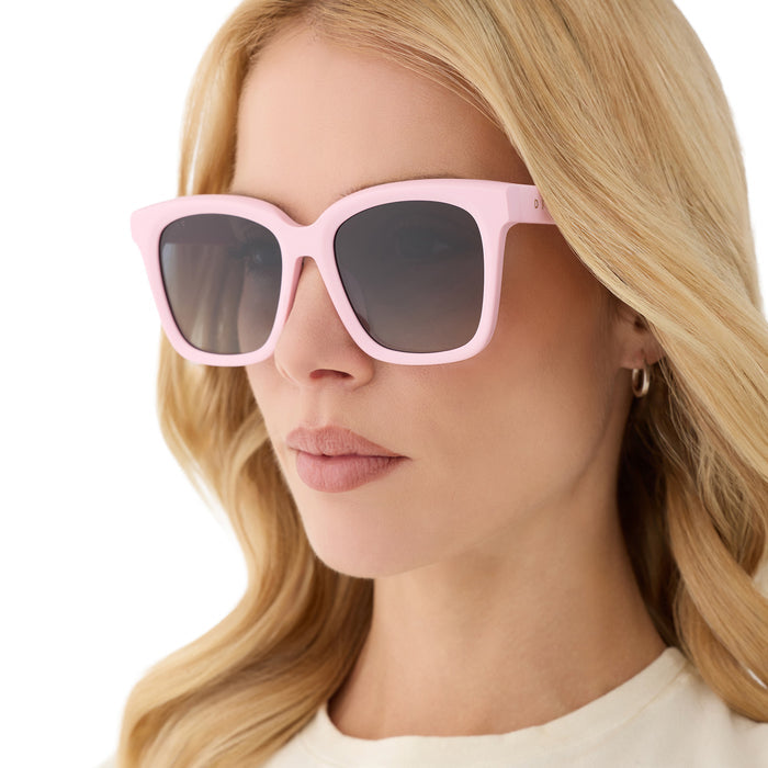on model - blonde female wearing diff eyewear featuring the meredith square sunglasses with a powder pink angled view