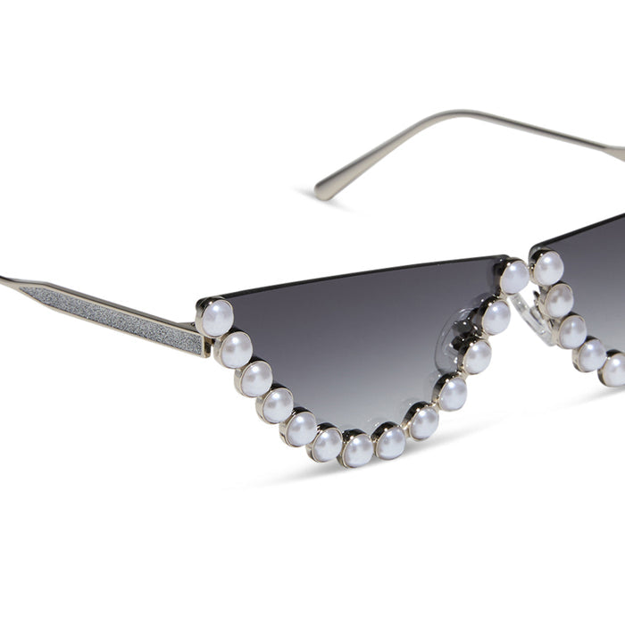 emily in paris x diff eyewear featuring the mindy 2.0 cateye sunglasses with a champagne pearl frame and grey gradient lenses detailed view