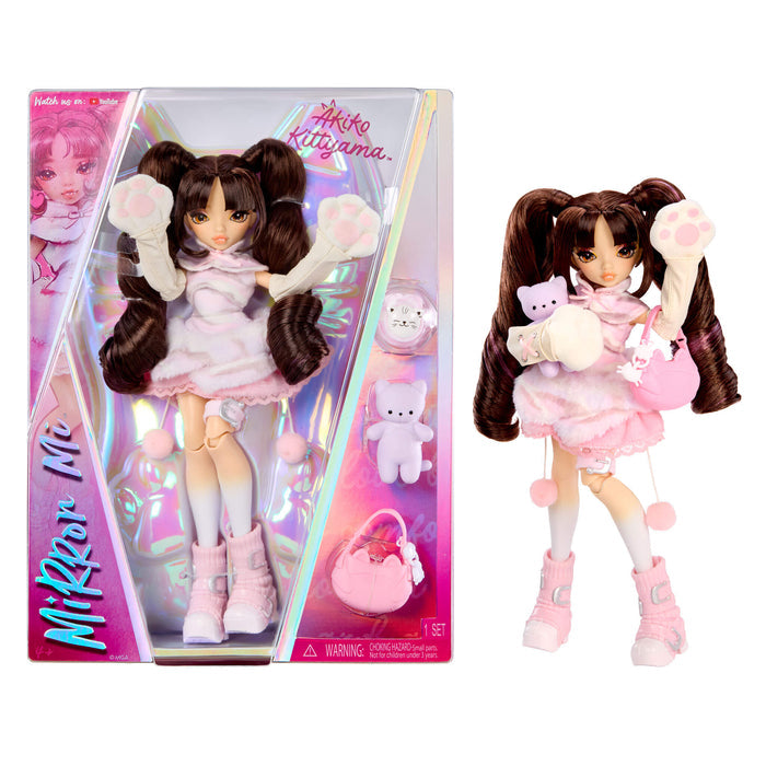 Mirror Mi Akiko Kittyama doll shown both inside its pink and holographic retail packaging on the left, and as a loose figure on the right against a plain white background. The doll has long dark brown pigtails, wears a light pink dress and matching boots, holds a small pink plush, and has a pink purse accessory visible in the package.