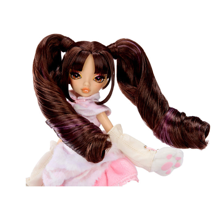 A doll with long dark brown pigtails, wearing a pink and white dress with a fluffy collar and white booties with pink paw prints on hands, isolated on a white background.