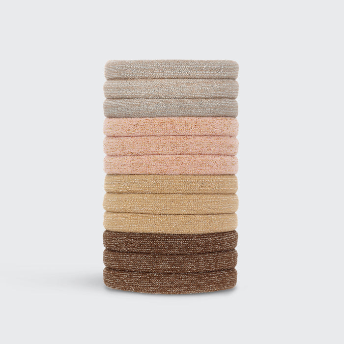 Stack of 12 Kitsch Neutral Glitter Hair Elastics in sage, blush, tan, and brown on a white background