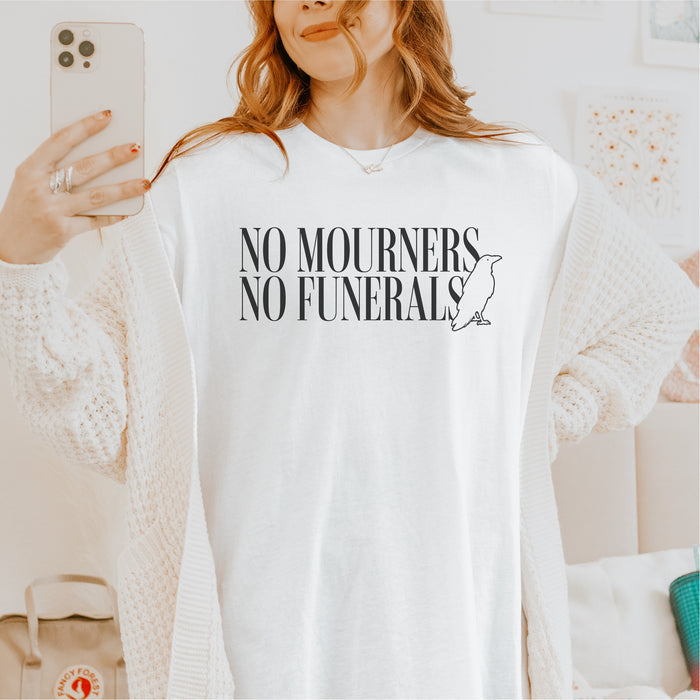 No Mourners No Funerals Tee Shirt - The Bean Workshop - Book lover gift, Bookish Apparel, Dark Fantasy, Fantasy Book Shirt., Kaz Brekker quote tee, Ketterdam, Leigh Bardugo fan merchandise, Literary Quote, Minimalist Aesthetic, No Mourners No Funerals t-shirt, Six of Crows quote shirt for readers, The Crows T-shirt, The Dregs