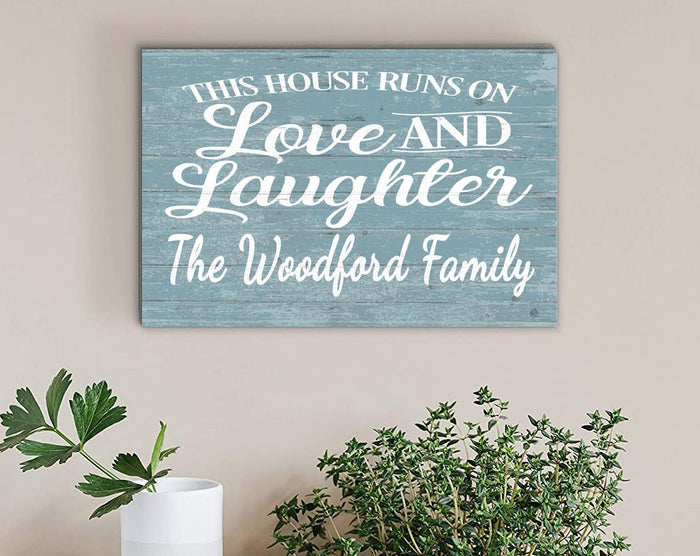 this house runs on love and laughter sign