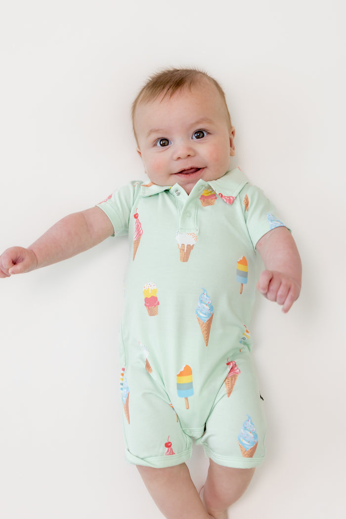 Baby wearing Mint Ice Cream Polo Shortall on a beige background
