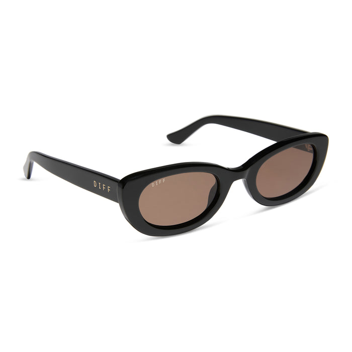 jojo fletcher x diff eyewear jordy round cat eye sunglasses with a black acetate frame and brown lenses angled view