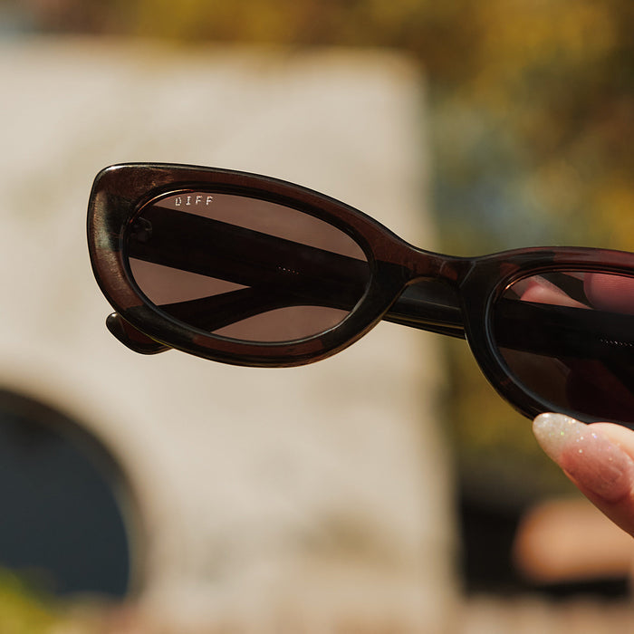 still life - jojo fletcher x diff eyewear jordy round cat eye sunglasses with a chocolate crystal acetate frame and grey polarized lenses