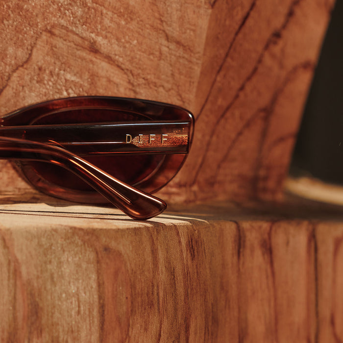 still life -  jojo fletcher x diff eyewear jordy round cat eye sunglasses with a horn tortoise acetate frame and brown lenses detailed view