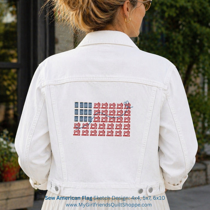 White denim jacket with American flag design on the back, worn by a person outdoors.