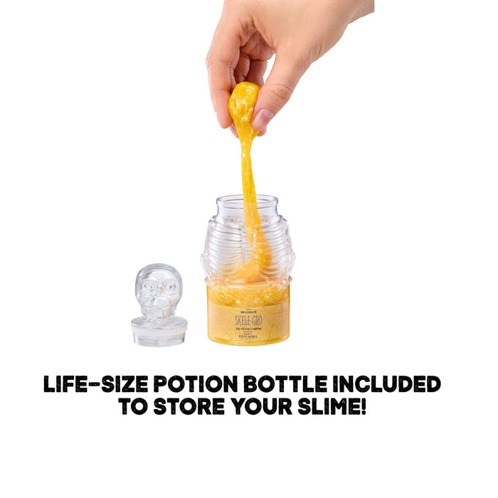 Hand pouring yellow slime into a clear jar with a life-size potion bottle included, on a white background.