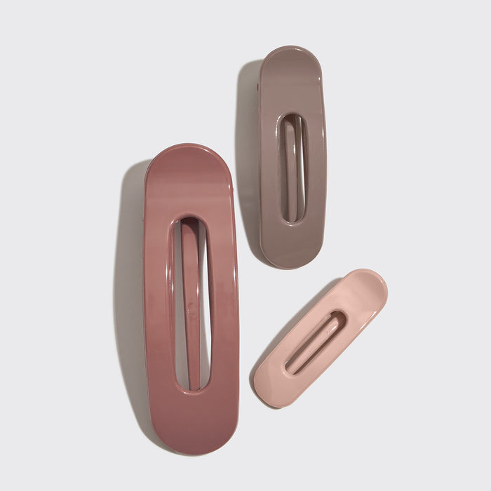 Three Terracotta Flat Claw Clips in neutral pink and brown shades on a light gray background