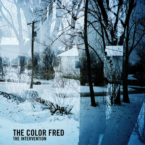 Album cover for The Intervention by The Color Fred shows a snowy, leafless suburban scene with bare trees, power lines, and houses, overlaid with a blue abstract double-exposure effect. Text is placed in the bottom left corner.