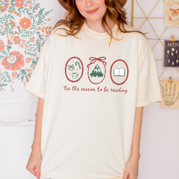 'Tis the Season to Be Reading T-Shirt - The Bean Workshop - Bookaholic, Bookish Humor, Bookworm Christmas Tee, Casual Wear, Christmas Gift, Christmas Reading Shirt for Book Lovers, Cozy Christmas, Festive Apparel, Gift for Readers, Hand-Drawn, Holiday Doodles, Holiday Graphic Tee, Tis the Season to be Reading T-Shirt