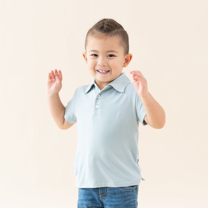 Toddler wearing Kyte Baby Short Sleeve Shirt with Polo Collar in Fog blue