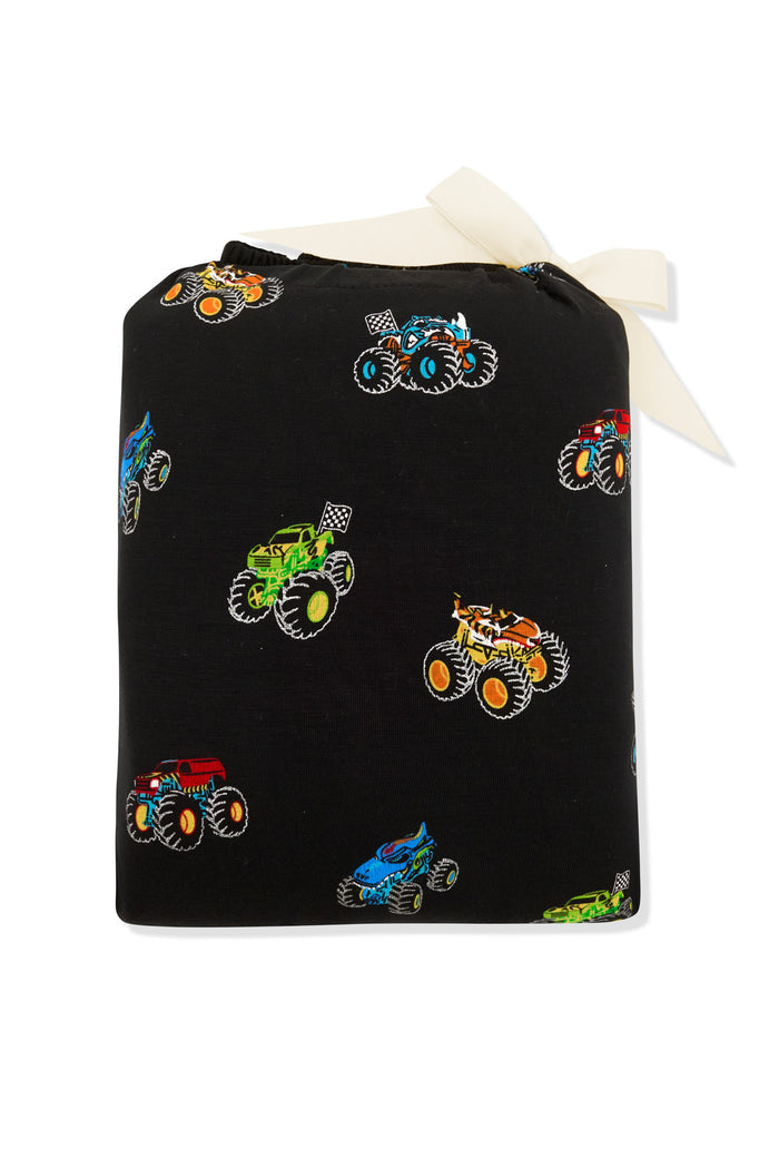 Twin Sheet packed in a colorful Monster Truck print bag on a white background