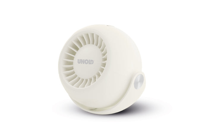 Der Unold Ventilator Breezy Bowl ist ein kompakter, weißer, runder Ventilator mit einem runden Gitter, das leicht zur Seite geneigt und auf einer weißen Oberfläche platziert ist, wo es einen weichen Schatten wirft.