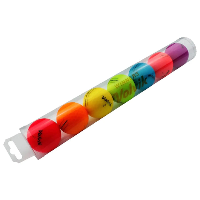 A cylindrical clear container holds six colored golf balls in red orange yellow green blue pink and purple arranged from left to right showcasing vibrant colors in a retail setting.