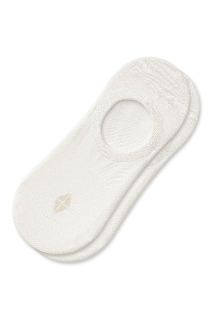 Two stacked white no-show socks with a small geometric logo on the toe, photographed on a clean white background.