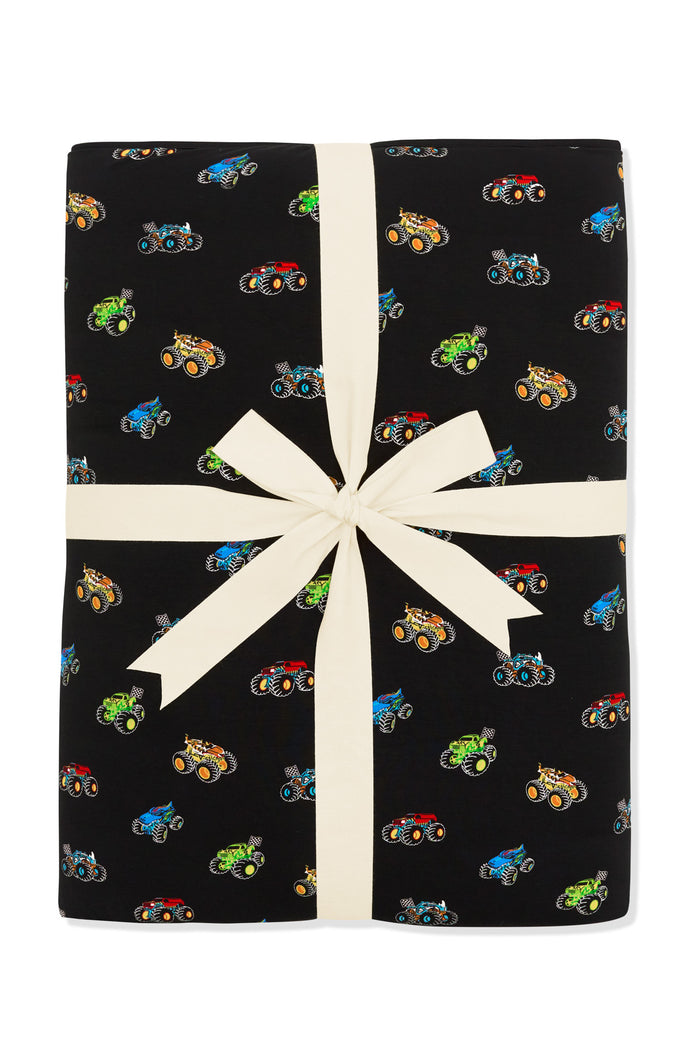 Youth Blanket in Monster Truck 2.5 packed with ribbon on white background
