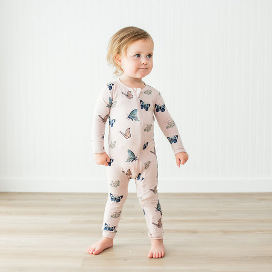 Toddler modeling Blush Butterfly Romper